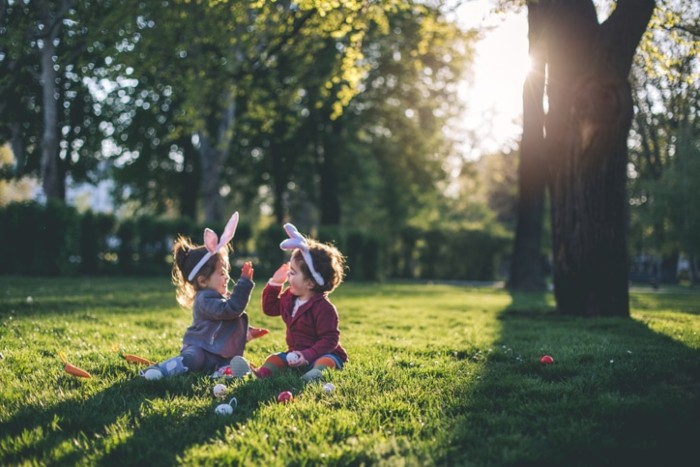 Cute Toddler Girls with Bunny Ears, Having Fun at the Park