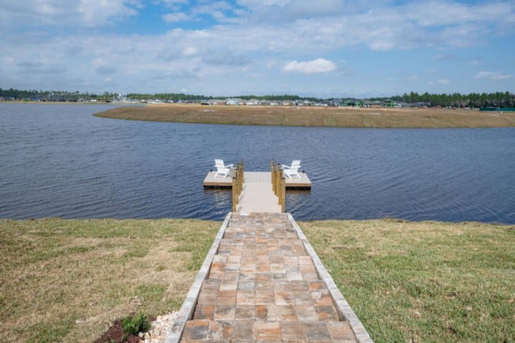 A Dock with Two Chairs on a Lake at Beacon Lake in St. Johns County, Florida.